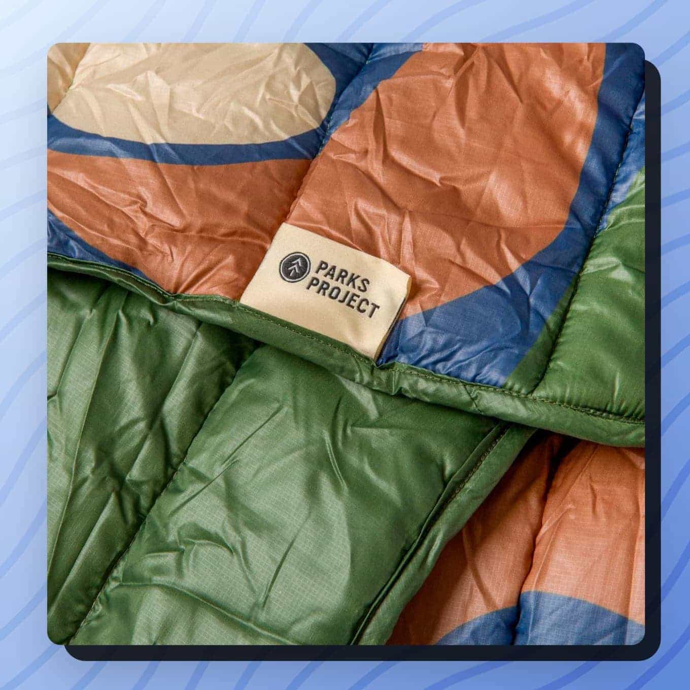 Closeup view of puffy blanket with a Parks Project label