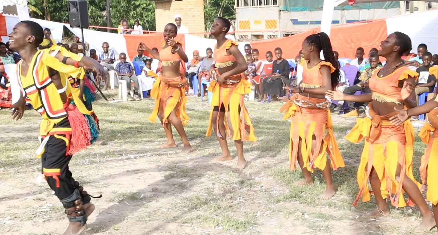 Students perform in traditional Indigenous clothing